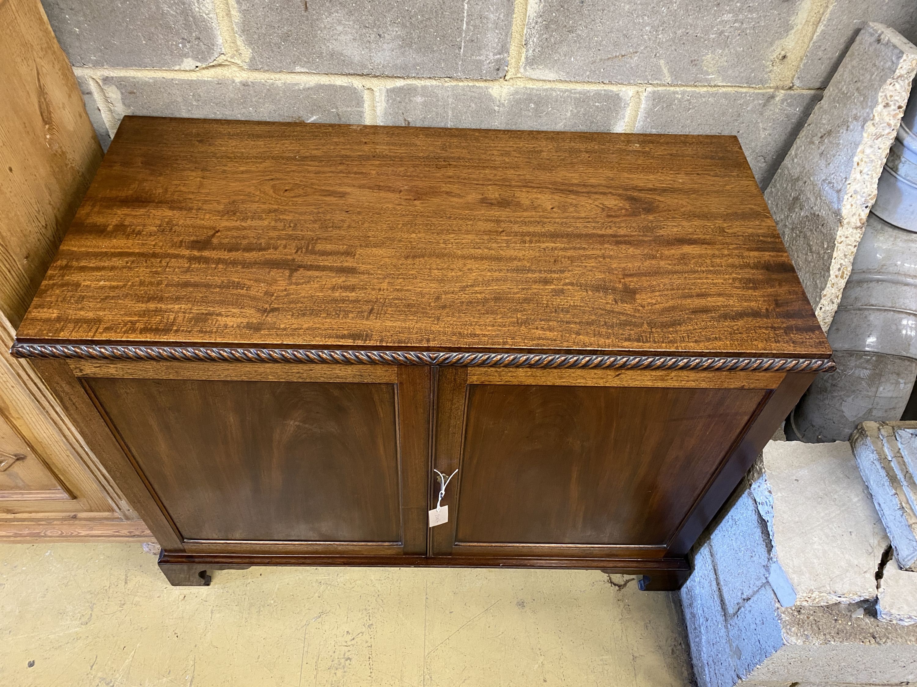 A mahogany two door side cabinet, width 110cm, depth 51cm, height 84cm